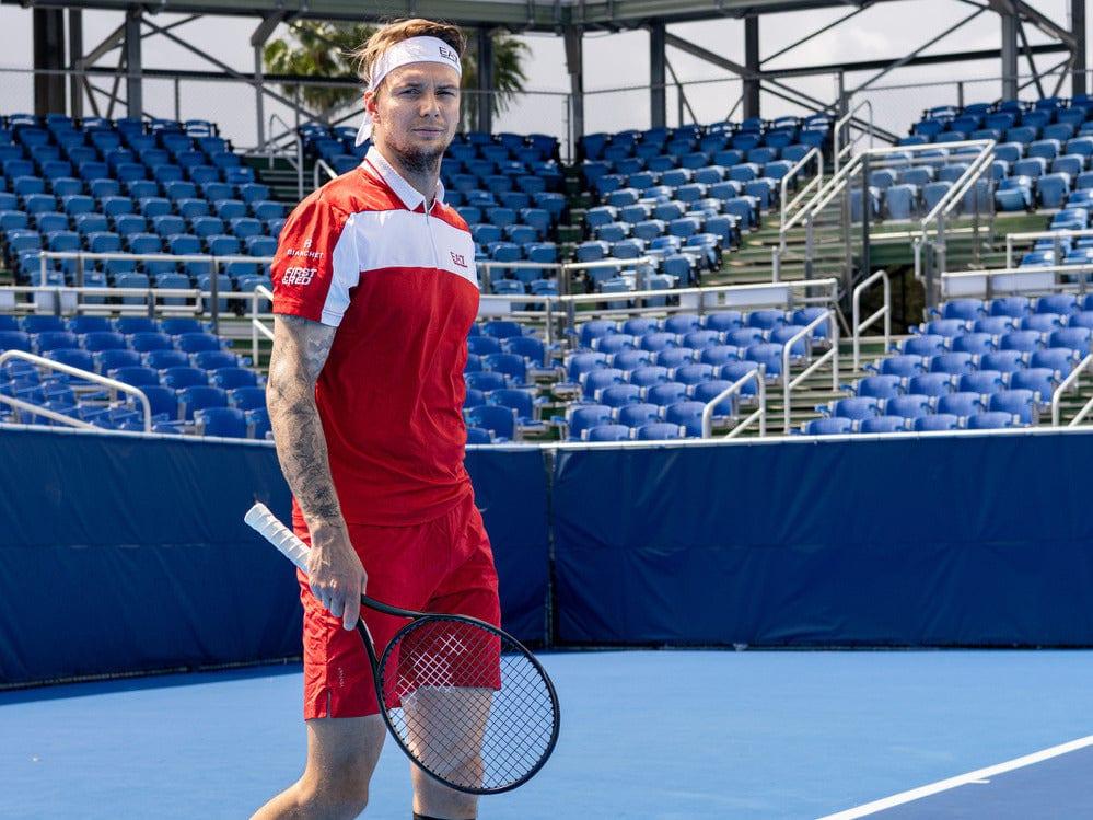 Alexander Bublik on court holding a Diadem racket